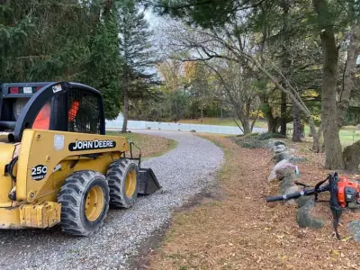 Skid steer grading the base course