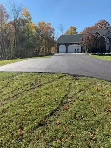 Wide driveway apron and garage approach