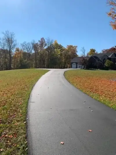 Sweeping driveway curve through a front lawn